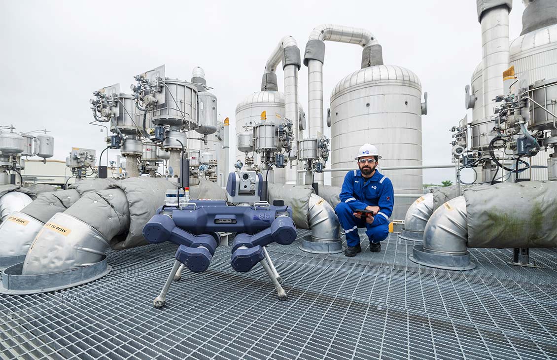 Image of an inspection robot and an operator in an oil and gas process facility.